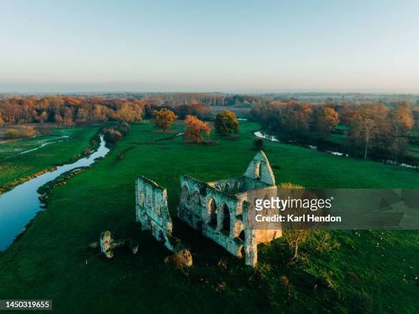 an aerial sunset view newark priory ruins, surrey - monastery stock pictures, royalty-free photos & images