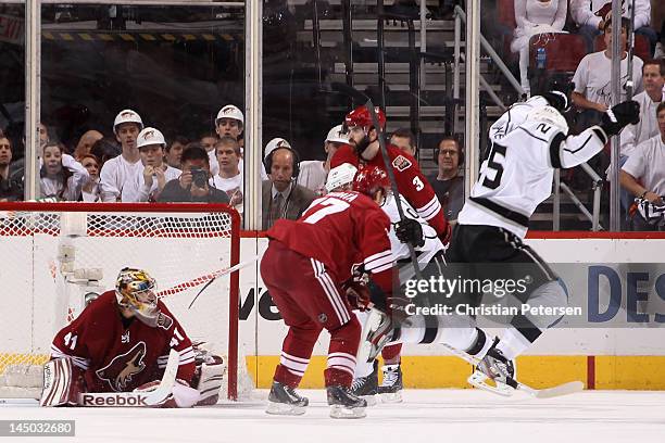 Dustin Penner of the Los Angeles Kings reacts after scoring the game-winning goal in overtime past goaltender Mike Smith of the Phoenix Coyotes as...