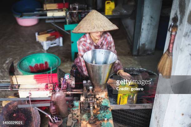 high angle view on vietnamese woman manufacturing incense sticks - village trestle stock pictures, royalty-free photos & images