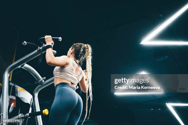 woman doing gym workout. woman training at fitness club. - weight bench stock pictures, royalty-free photos & images