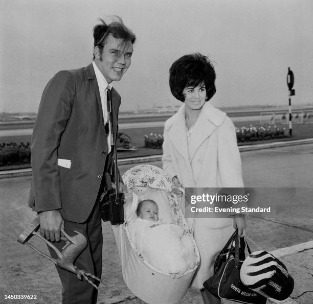 British pop singer Marty Wilde with wife Joyce and baby daughter Kim arriving at London Airport after his tour of South Africa, on April 21st, 1961.
