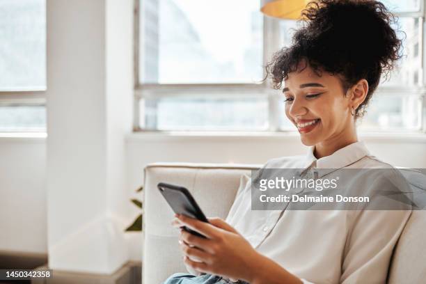 phone, relax and woman on social media for happy online content or internet entertainment on house sofa. smile, digital or young girl enjoys texting, chat or typing a post while reading global news - subscription stockfoto's en -beelden