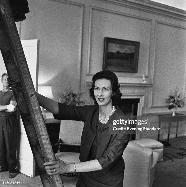 Interior decorator Penelope Kitson, one of J Paul Getty's female companions, preparing the billionaire industrialist's Sutton Place mansion in Surrey...