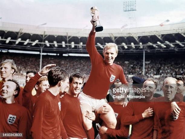 World Cup Final at Wembley Stadium, England versus West Germany. Captain Bobby Moore holds aloft the Jules Rimet trophy as he sits on the shoulders...