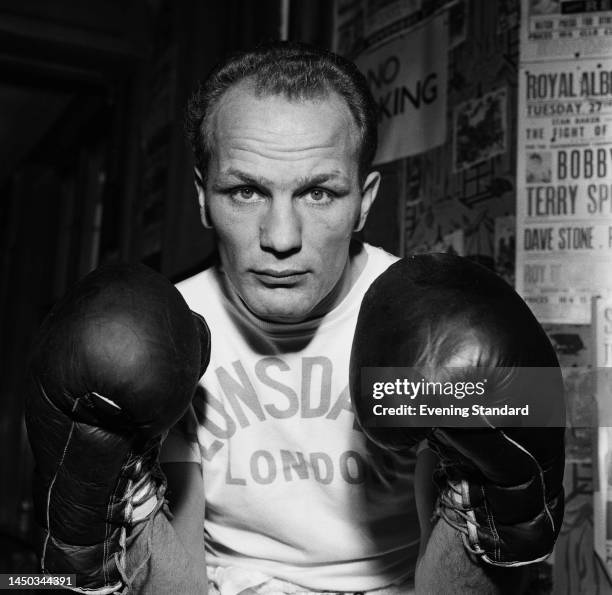 British boxer Henry Cooper posing in boxing gloves on October 3rd, 1961.