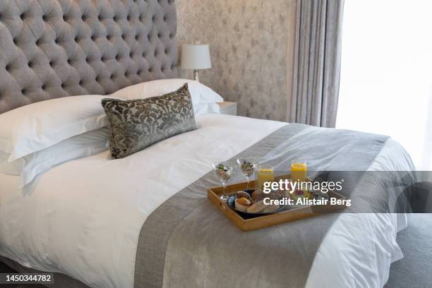 breakfast delivered to luxury hotel room - hotel suite stock pictures, royalty-free photos & images