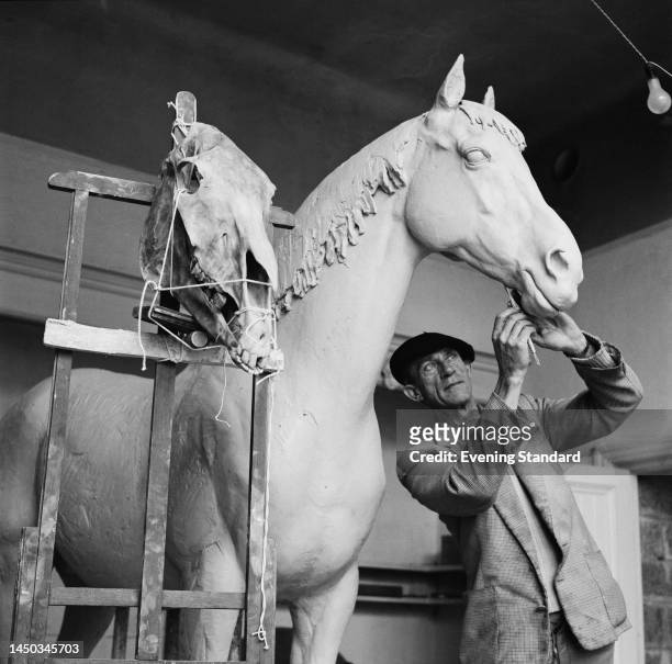 British painter and sculptor John Skeaping working on a plaster model of his sculpture 'Hyperion' on October 20th, 1961. 'Hyperion' was a racehorse...