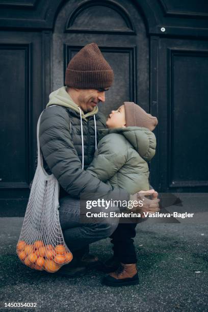 happy family dad and son on a walk in winter - zagreb winter stock pictures, royalty-free photos & images