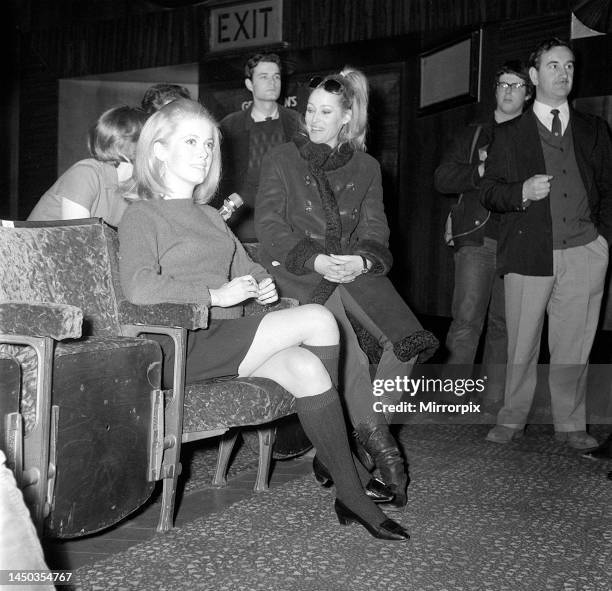 Catherine Deneuve and Ursula Andress in the stalls at the rehearsal of the Royal Film Show. 13th March 1966.