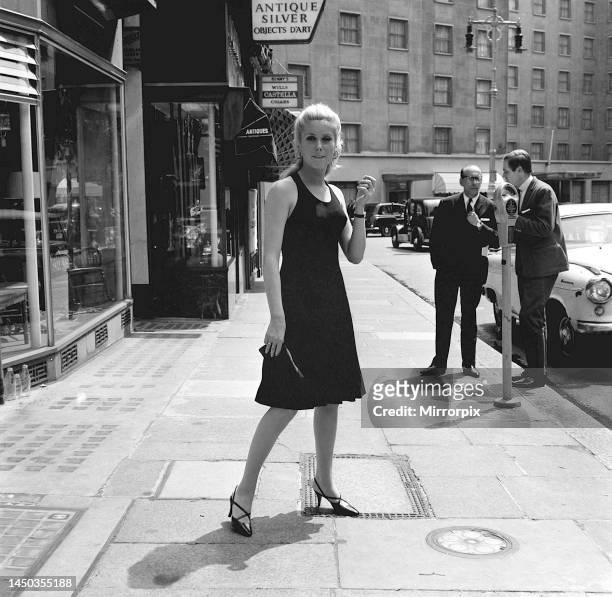 Actress Catherine Deneuve, star of the film Repulsion, which has its premiere at the Rialto Cinema, pictured in Conduit Street, London after arriving...