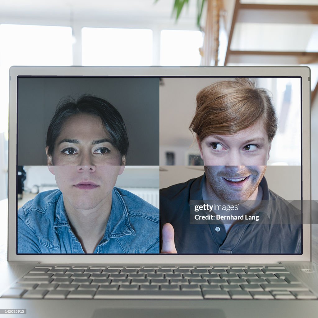 Parts of faces displayed on laptop screen