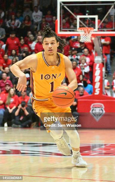 Walter Clayton Jr. #1 of the Iona Gaels dribbles against the New Mexico Lobos during the first half of their game at The Pit on December 18, 2022 in...