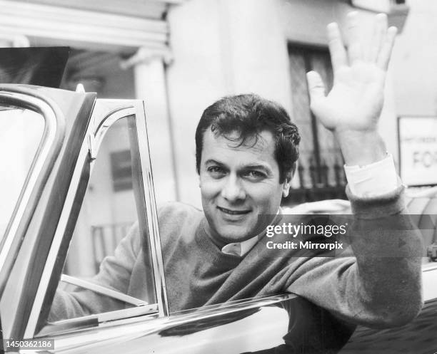 Tony Curtis poses for pictures in his Alvis TE21 motorcar in Knightsbridge, London. 2nd September 1965.