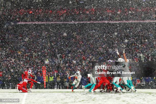 Tyler Bass of the Buffalo Bills kicks the game winning field goal against the Miami Dolphins at Highmark Stadium on December 17, 2022 in Orchard...