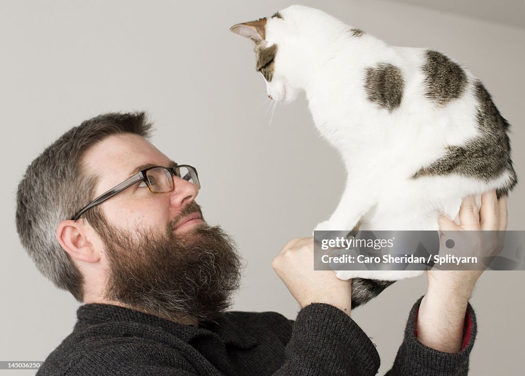 Bearded man and kitten