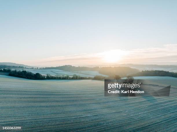 an aerial view of surrey hills at sunrise during heavy frost - west sussex stock pictures, royalty-free photos & images