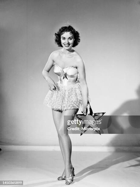 Woman wearing Christmas fairy fancy dress. 25th December 1959.
