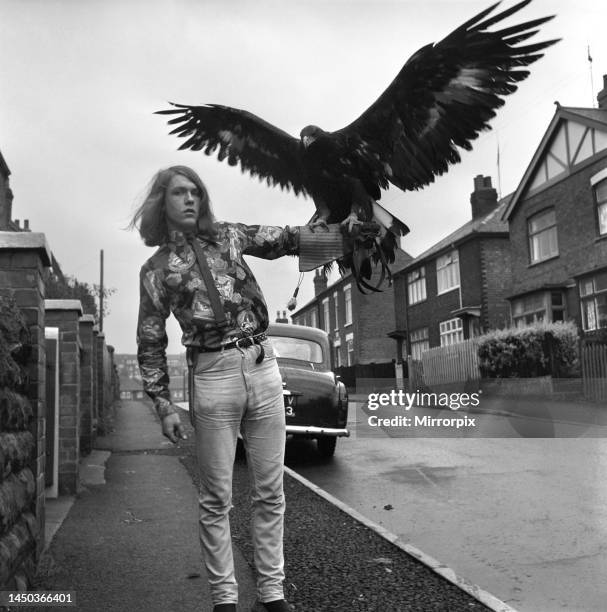 David Fox seen here taking his pet golden eagle for a walk around the local neighbourhood. 1965.