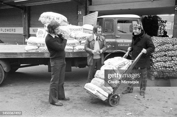 Fran Cotton, England's newly appointed Captain seen he helping his Coventry team mate Keith Fairbrother at his business in Coventry's Wholesale Fruit...