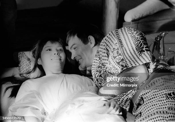 Sean Connery in bed with Akiko Wakabayashi during the filming of You Only Live Twice. 9th October 1966.