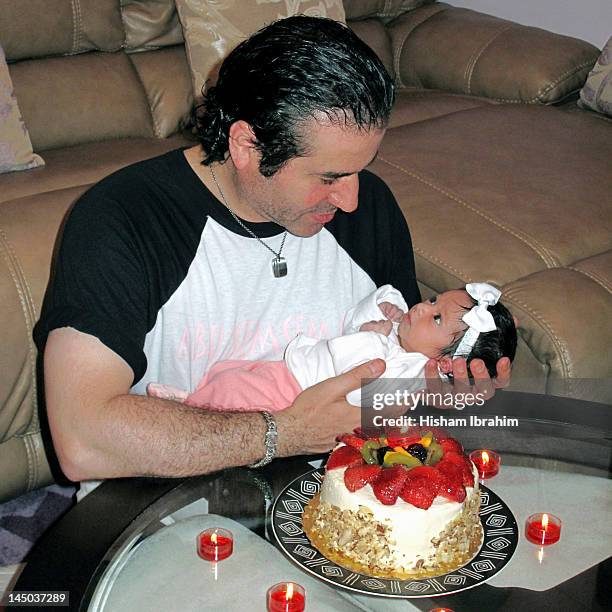 father and daughter at her one week birthday party - tea light stock pictures, royalty-free photos & images