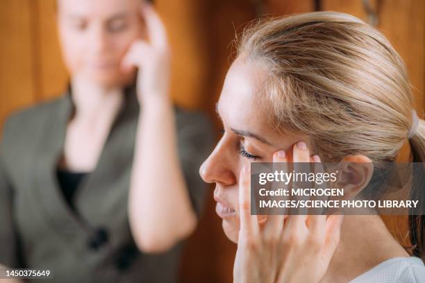 eft head tapping technique - image technique stock pictures, royalty-free photos & images