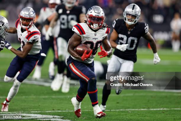 Rhamondre Stevenson of the New England Patriots runs with the ball during an NFL football game between the Las Vegas Raiders and the New England...