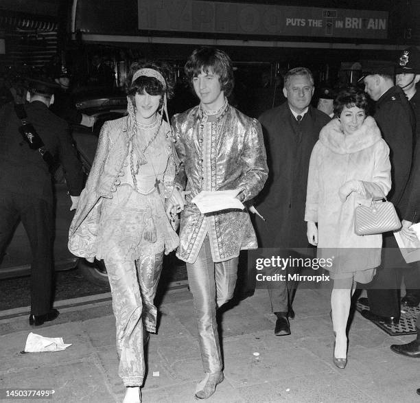 Eric Clapton of the progressive rock group Cream arriving with guest at the premiere of the film How I Won The War.