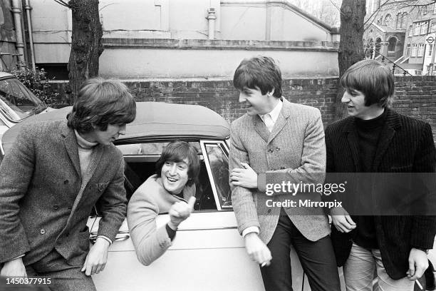 John Lennon passes his driving test. Paul McCartney Ringo Starr and George Harrison are there to congratulate him.