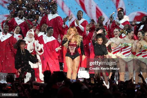 In this image released on December 19, Mariah Carey performs onstage with Moroccan Cannon and Monroe Cannon during her "Merry Christmas To All!" at...