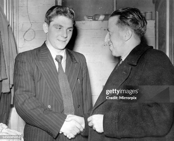 Manchester United league debutante 16 and a half years old Duncan Edwards receives congratulations after the game from Mr Jim Murphy the team...