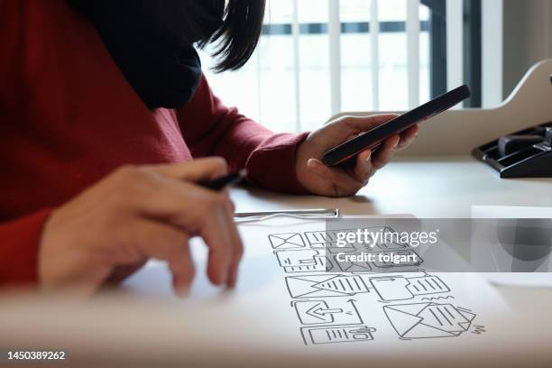 woman using mobile phone with envelope icons - customer engagement stock pictures, royalty-free photos & images