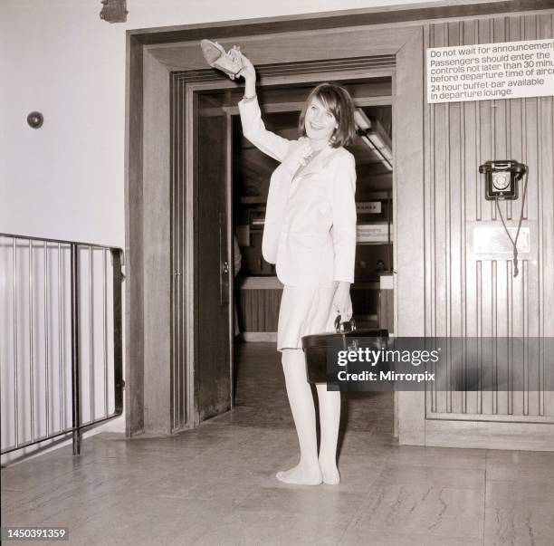 Sandie Shaw on her 19th birthday at London Airport bound for Paris to start a five week continental tour. February 1966.