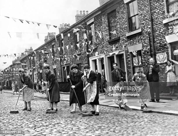 Queen Elizabeth II Coronation. Residents from Pine street in Newcastle decorating it in preparation for the coronation, with both children and adults...
