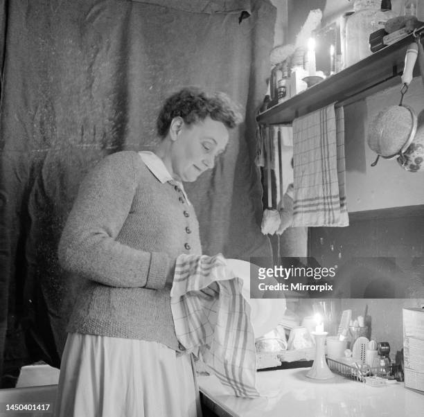 Mrs Dorothy Mead who still lights her house with gas lamps. Circa 1958.