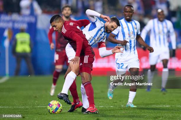 Gabi Fernandez of Real Zaragoza competes for the ball with Juan Muñoz of CD Leganes during the LaLiga SmartBank match between CD Leganes and Real...