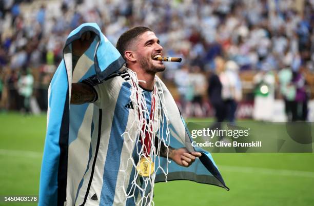 Rodrigo De Paul of Argentina celebrates with a cigar, Argentina flag and a cut piece of the net after the win during the FIFA World Cup Qatar 2022...