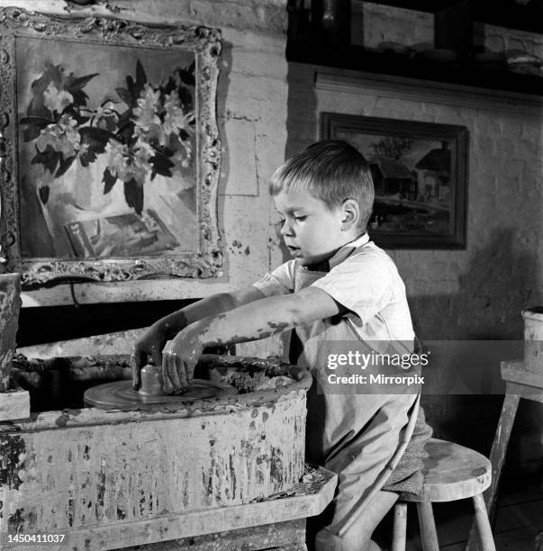 Child at the potters wheels in David Rawnsley's Chelsea studio. September 1952.