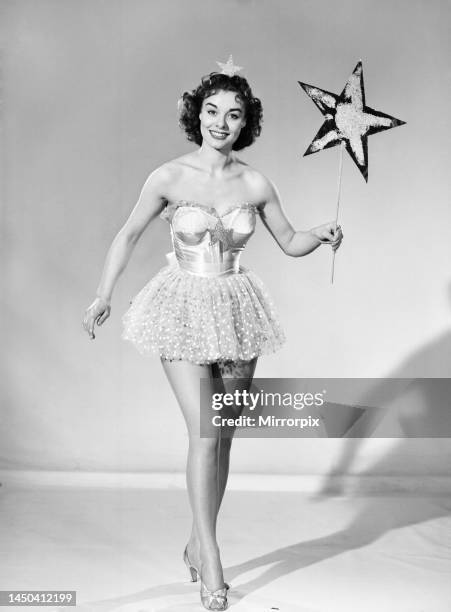 Woman wearing Christmas fairy fancy dress. 25th December 1959.