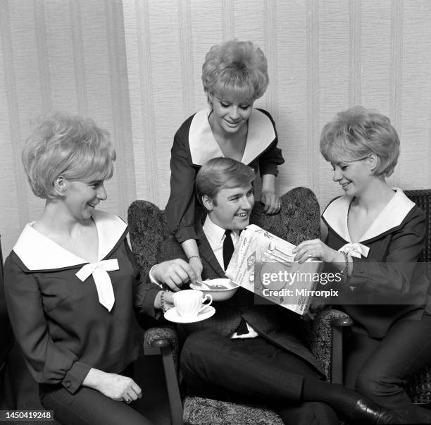 Pop group The Bell sisters from Liverpool serve cereal to Alan David, the singing compere of the BBC2 pop show Gadnooks, It's the In Crowd The...