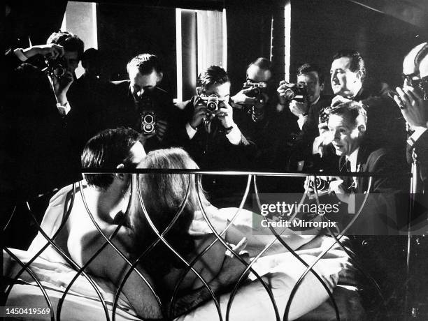 Sean Connery and Luciana Paoluzzi pose together in bed for the the press photocall of the James Bond 007 film Thunderball. March 1965.