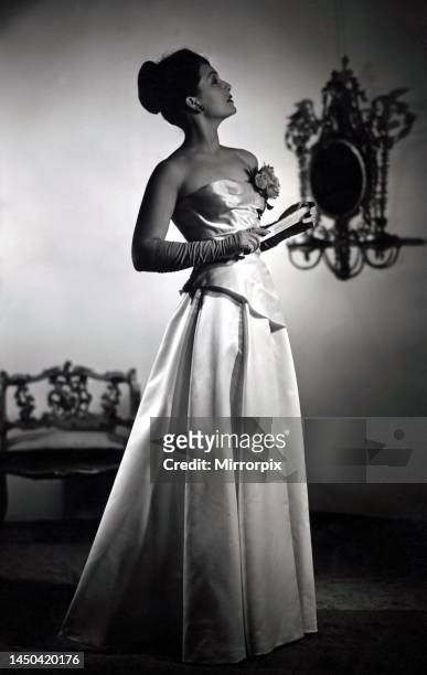Jean Kent, star of Bond Street models her most glamourous evening-gown created for her by Matilda Etcher for the Royal Command Film performance on...