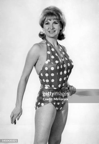 Model Caron Gardner wearing a polka dot patterned swimsuit. July 1965.