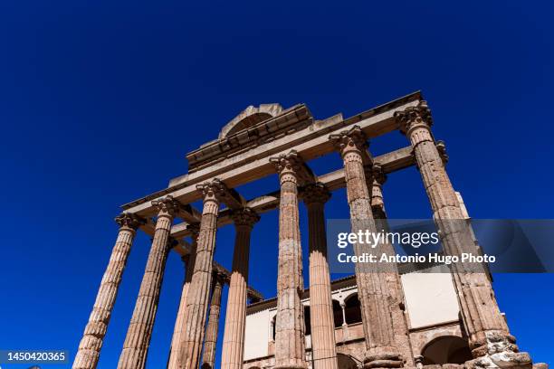 ruins of the ancient roman temple of diana in the city of merida, extremadura, spain. - diana roman goddess stock pictures, royalty-free photos & images