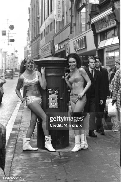 Carole Kirkley and brunette Angela Harvey modelling clothes from Etam in Oxford Street. 16th December 1965.