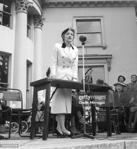 Marlene Dietrich speaking at The Holme, Regents Park, at a garden party that was held in aid of The Sunshine Homes for the Blind Babies July 1954.