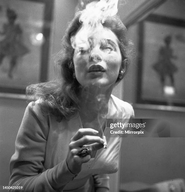 Actress Janet Leigh gets her nicotine fix at a costume fitting for the film The Vikings 1957.