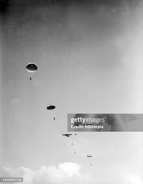 British Paratroopers jump from a Whitley transport plane.