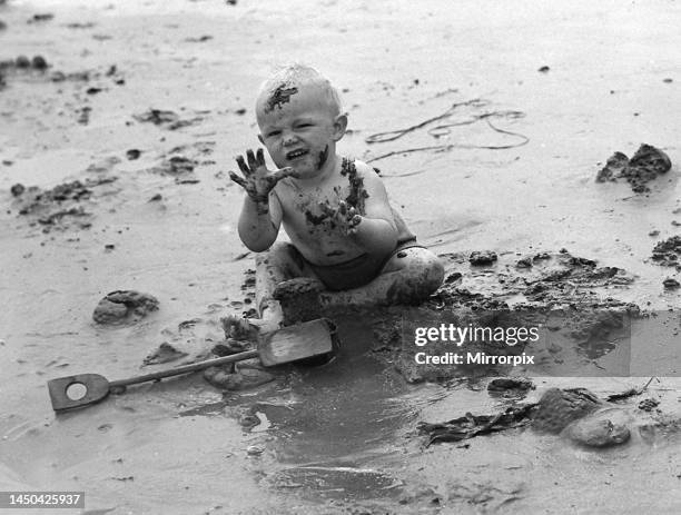 Mud Mud Glorious Mud. A small boy seen here enjoying himself on the muddy beaches of Southend. 1948.