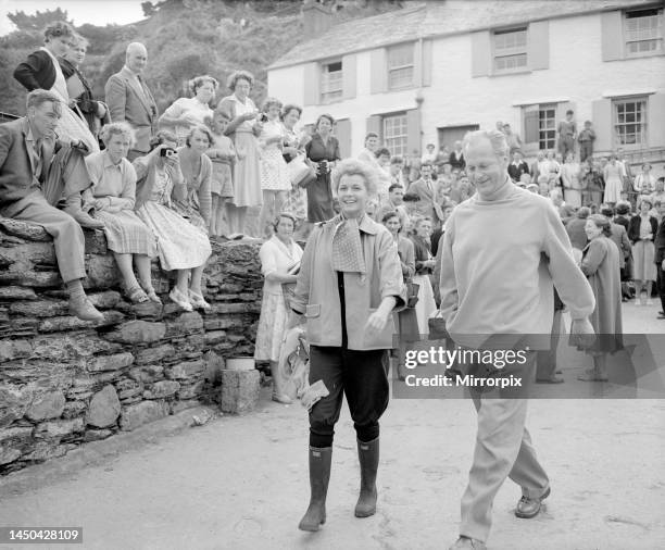 Actress Eve Bartok on film location in Polperro Cornwall with German actor Kurd Jurgen who is visiting her on set. They are pictured walking together...